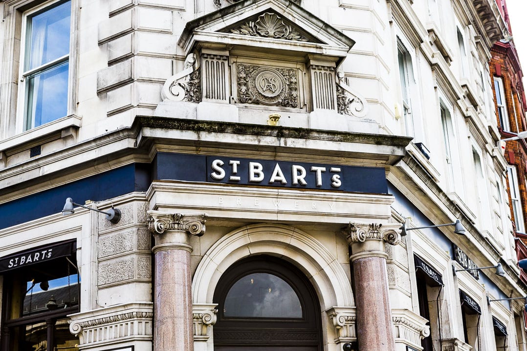 A photo of the front of st bart's brewery in london