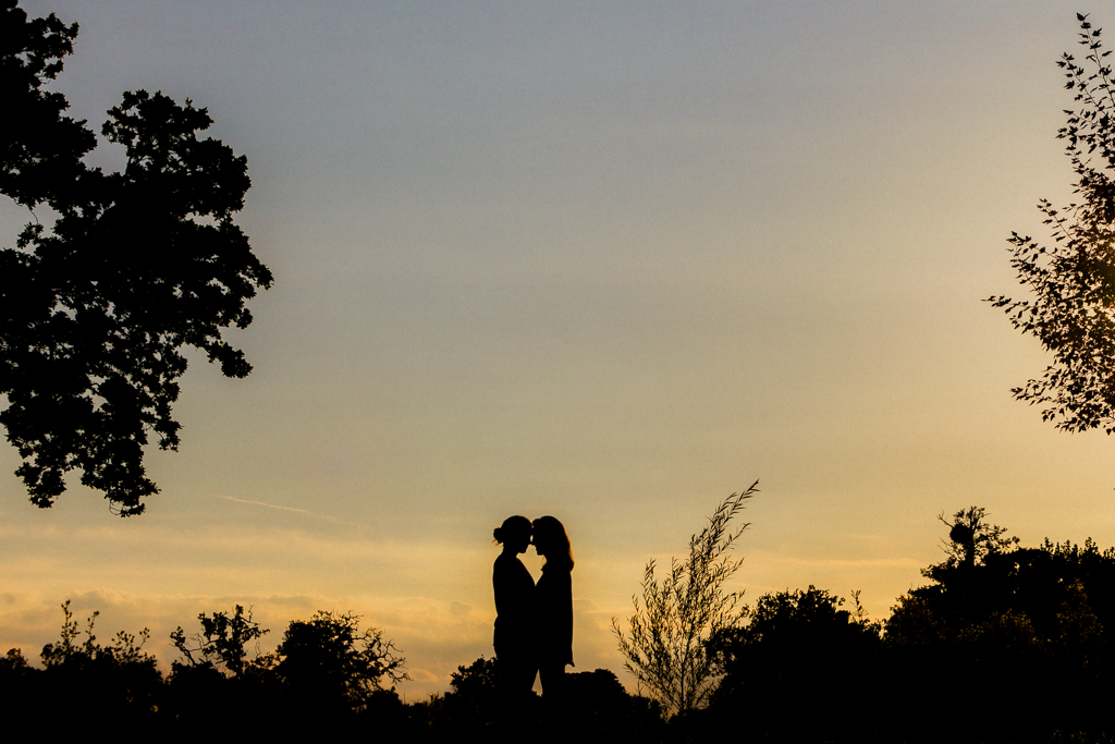 A silhouette of a couple on their wedding day