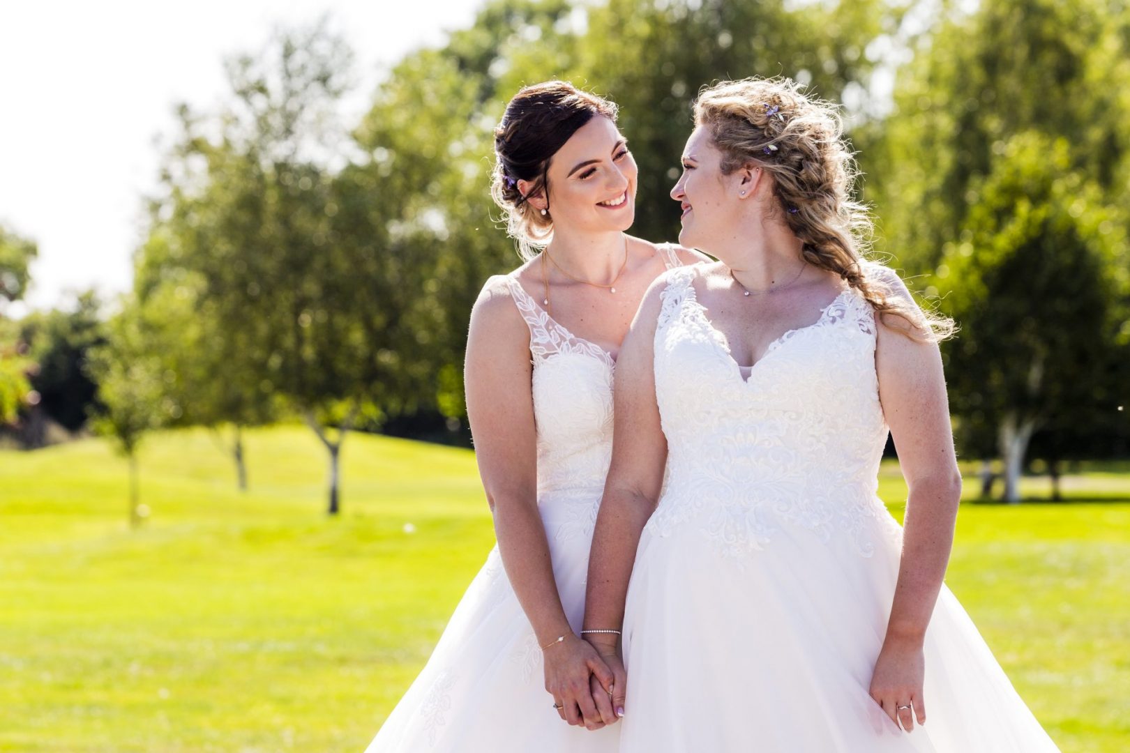 A lesbian couple gaze into each others' eye during their Essex Wedding
