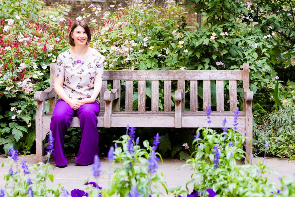 Celbrant Kathryn Palmer-Skillings sat on a park bench