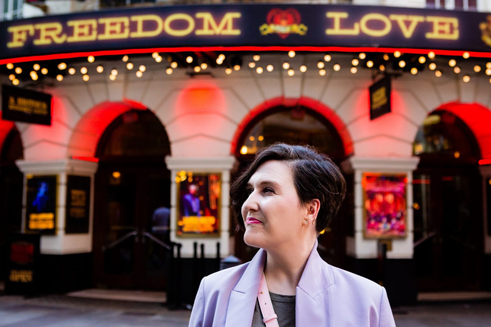 London wedding celebrant Nat Raybould in front of the Moulin Rouge theatre in London