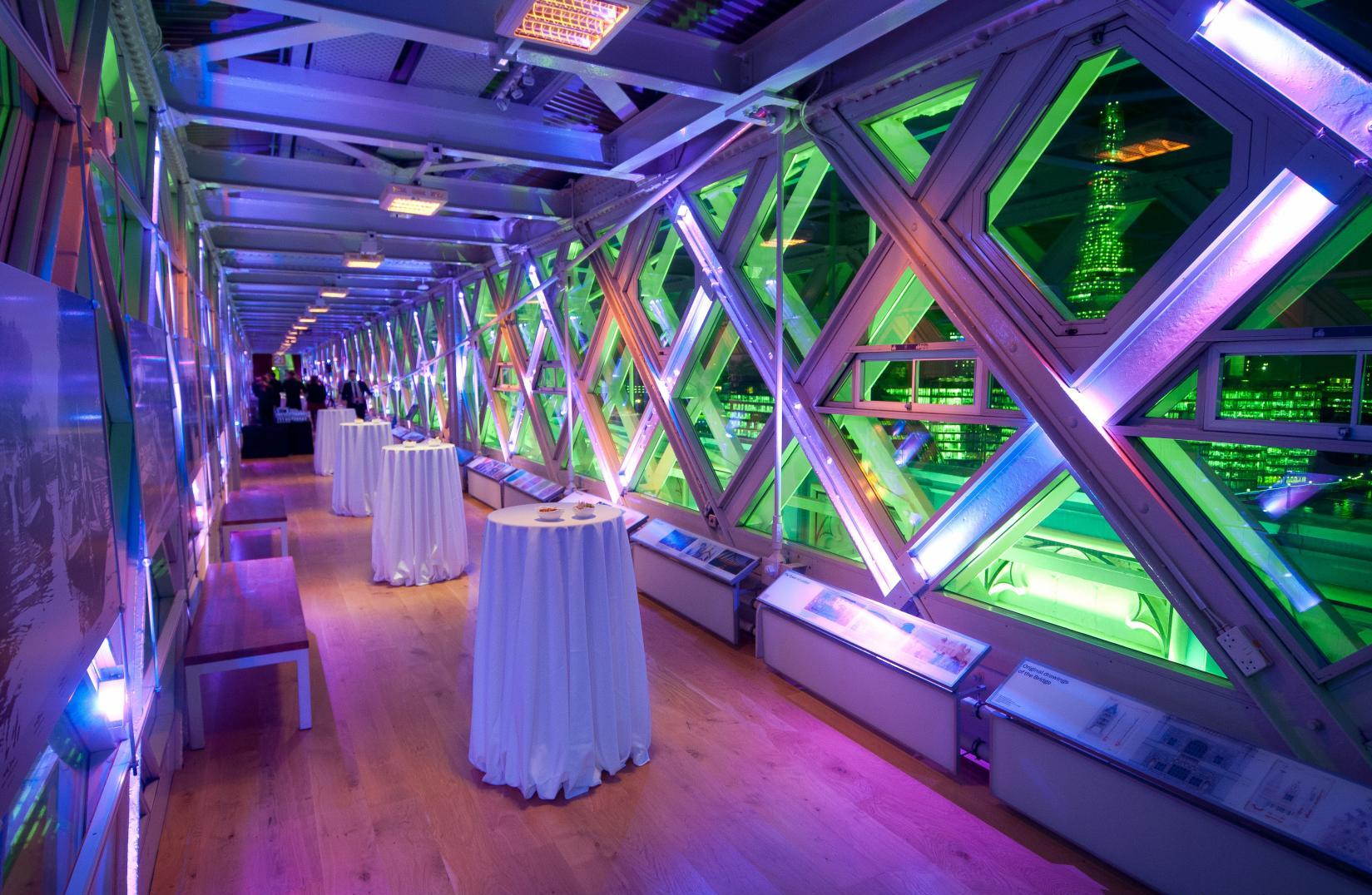 The interior of Tower Bridge set up for a wedding reception at night
