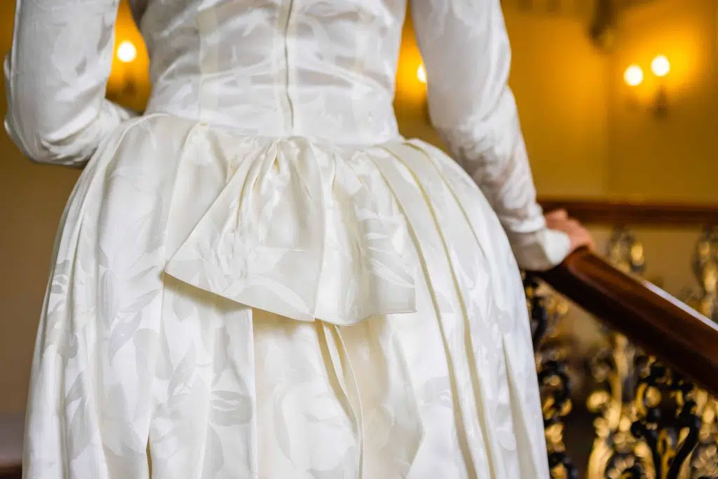 Close up of a bow on a vintage wedding dress