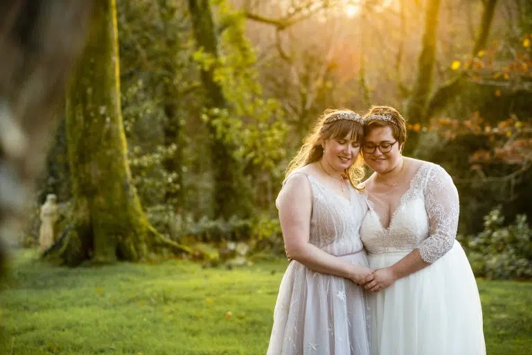 Two brides in an intimate moment on their wedding day, capturing sensitively by an LGBTQ wedding photographer in London.