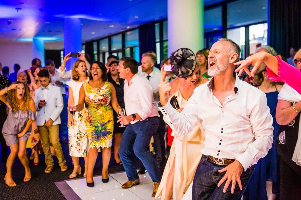 Candid shot of guests on a dance floor at a London gay wedding