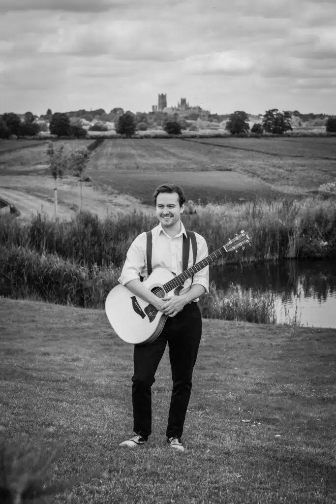 Joe Bailey at Old Hall ELy with the Ely Cathedral i nthe background