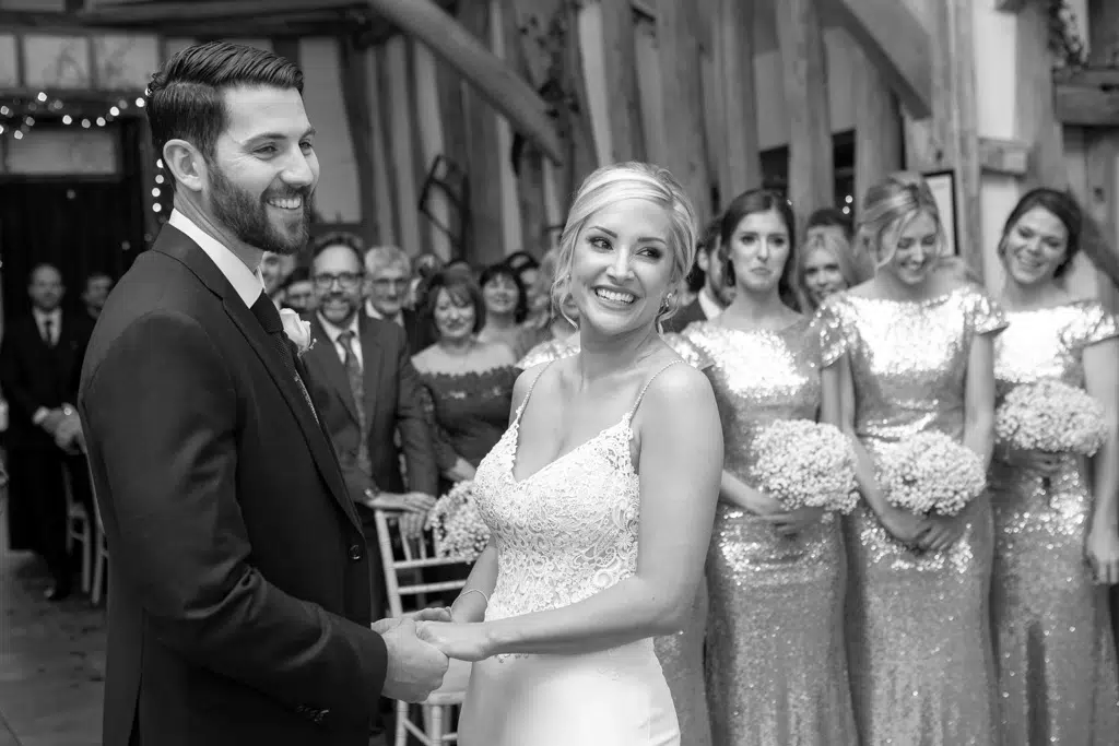 Chelmsford wedding photographer. A couple laughing during their wedding ceremony