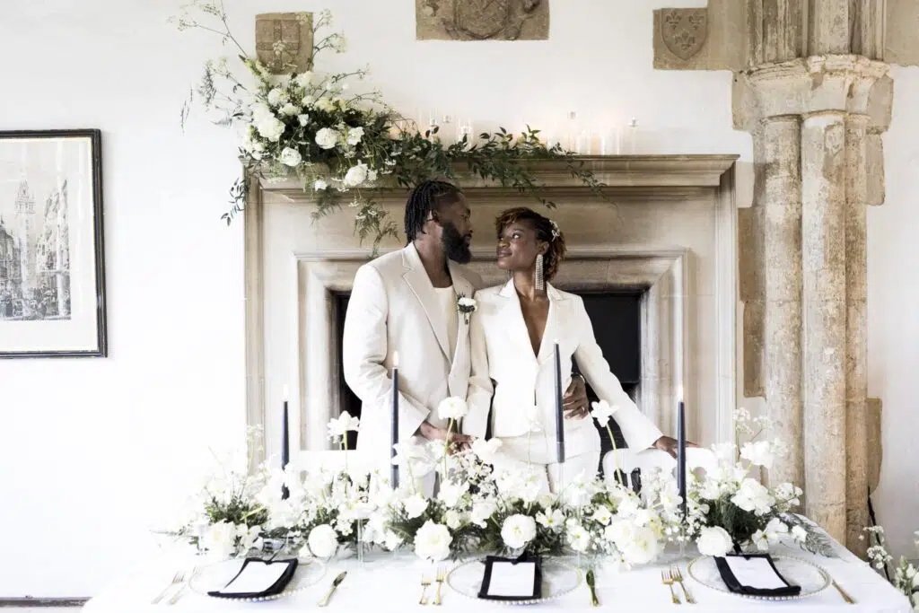 butley priory wedding photographer image of couple at wedding breakfast table