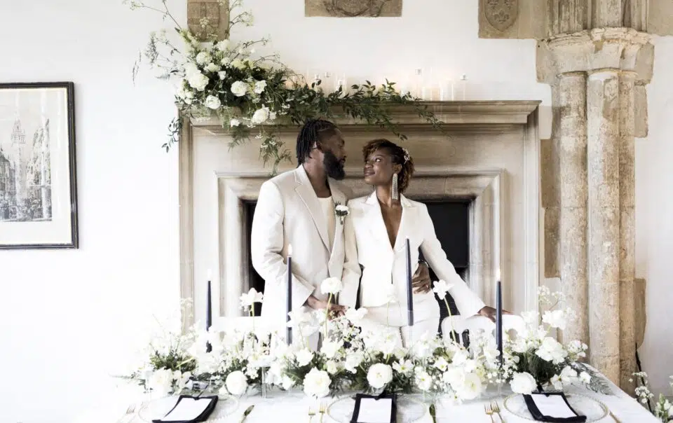 butley priory wedding photographer image of couple at wedding breakfast table