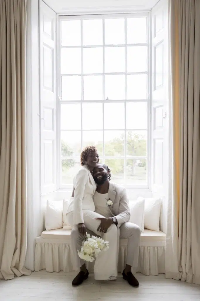 a couple in the window at butley priory