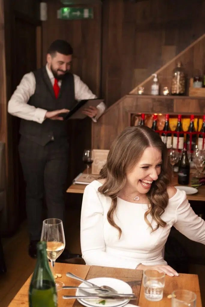 A bride doubled ver with laughter during her wedding speeches