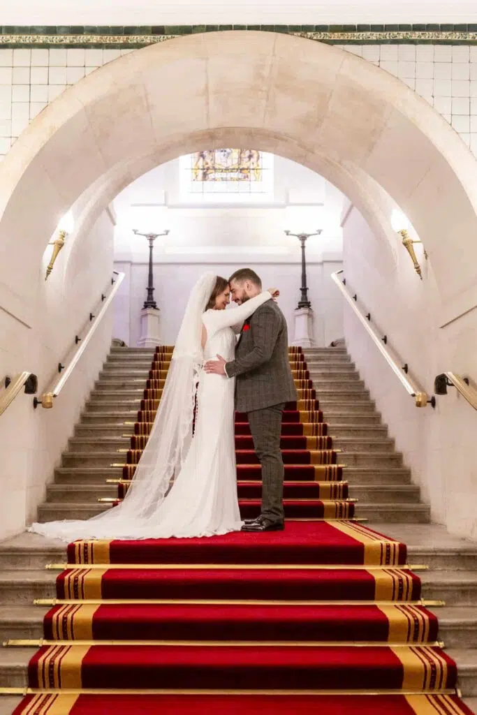 Couple posing o the stairs at The Law Society
