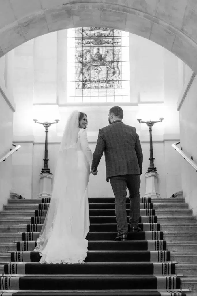 A couple walking up the stairs at The law Society