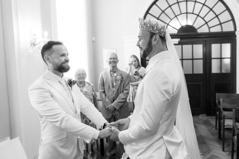 Pete and Will exchanging vows during their wedding ceremony at Chelsea Old Town Hall.