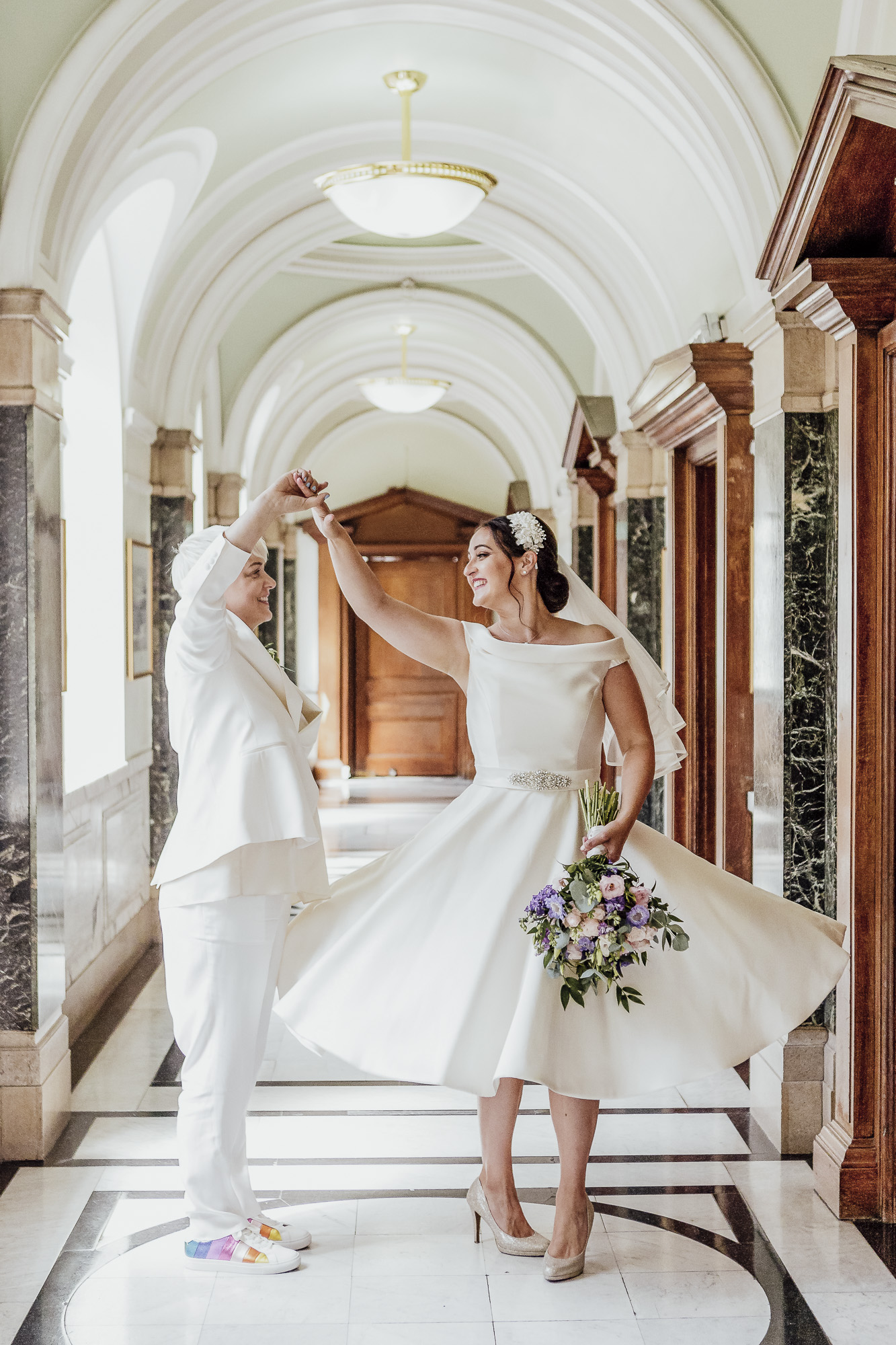 An emotional moment between two brides during their London wedding, captured in a relaxed style that celebrates genuine connection by and LGBTQ+ wedding photographer in London.